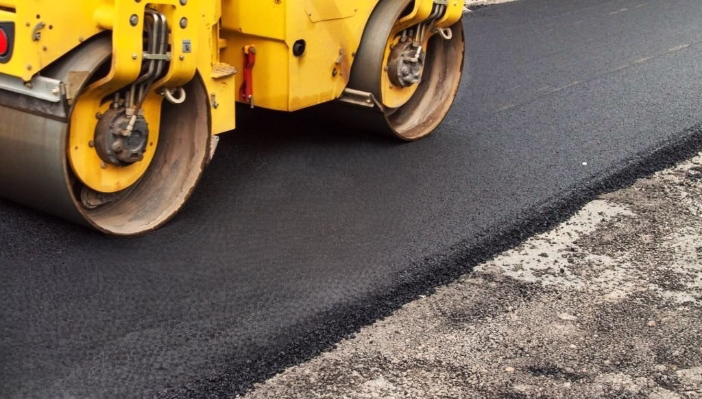 Tar Surfacing. Road Construction